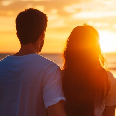 Couple Watching the Sunset, Symbolizing Stronger Relationships Through Coaching